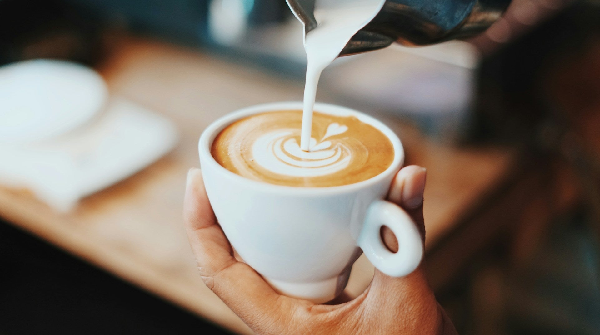 a coffee being poured at a shop in clermont, fl